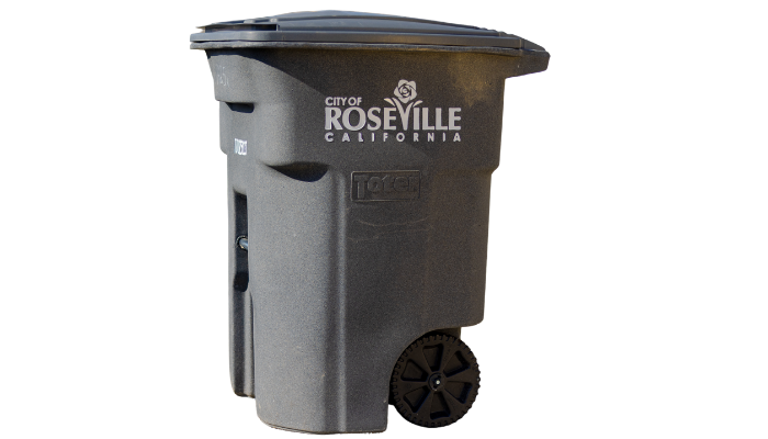 A grey rolling trash bin with the City of Roseville, California logo on the side